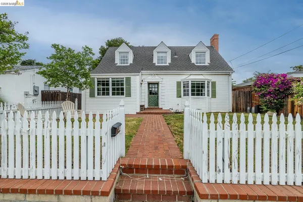 a front view of a house with a porch