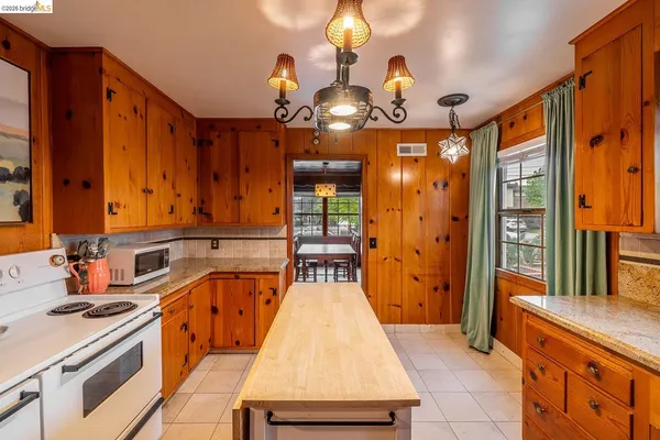 a view of a kitchen with a sink and cabinets