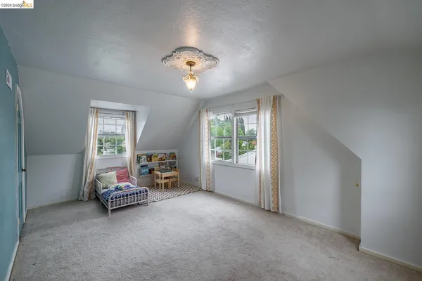 a view of a livingroom with furniture and a window