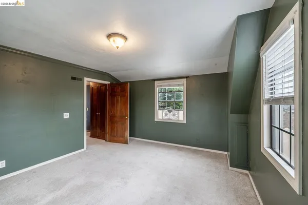 a view of livingroom with a ceiling fan and window