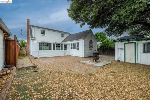 a house view with a backyard space