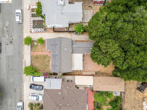an aerial view of residential houses with outdoor space
