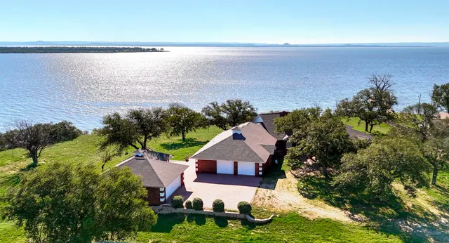 a view of a lake with a yard