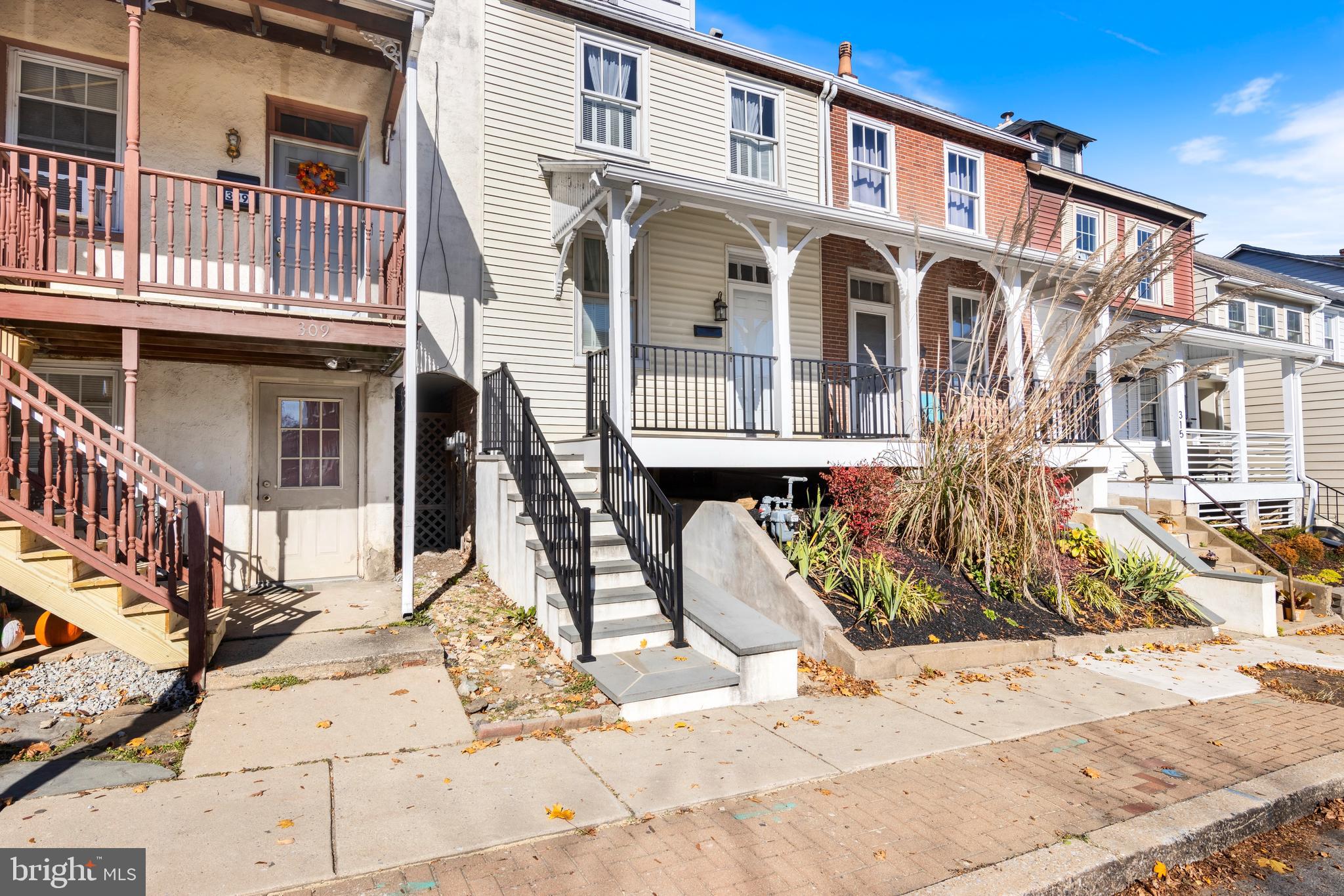 311 State Street Kennett Square, PA 19348 - Photo 1 of 37 a front view of a house with large windows