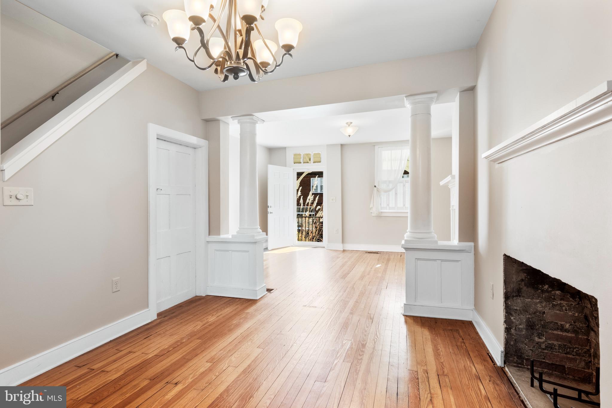 311 State Street Kennett Square, PA 19348 - Photo 15 of 37 a view of a livingroom with wooden floor and a kitchen space