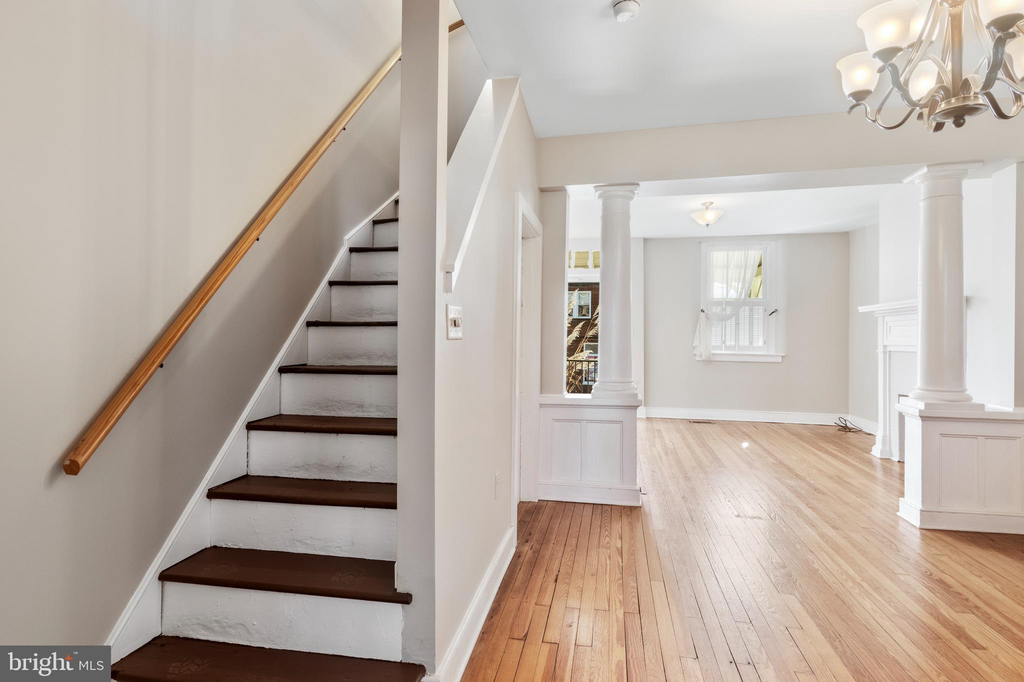 311 State Street Kennett Square, PA 19348 - Photo 16 of 37 a view of staircase with white walls and wooden floor