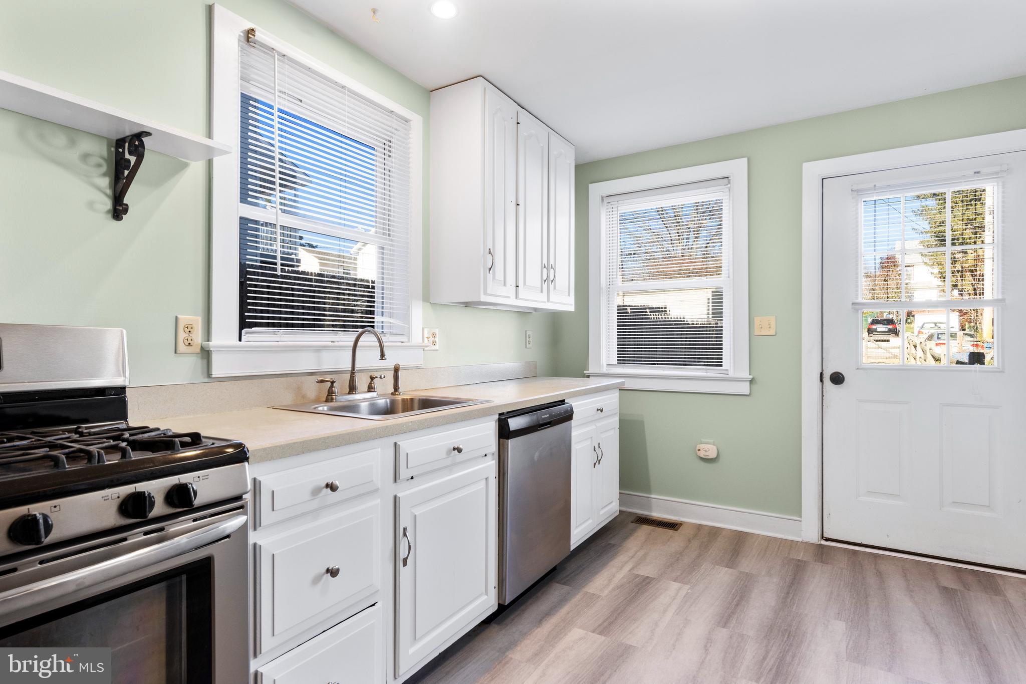 311 State Street Kennett Square, PA 19348 - Photo 20 of 37 a kitchen with a sink appliances cabinets and a window