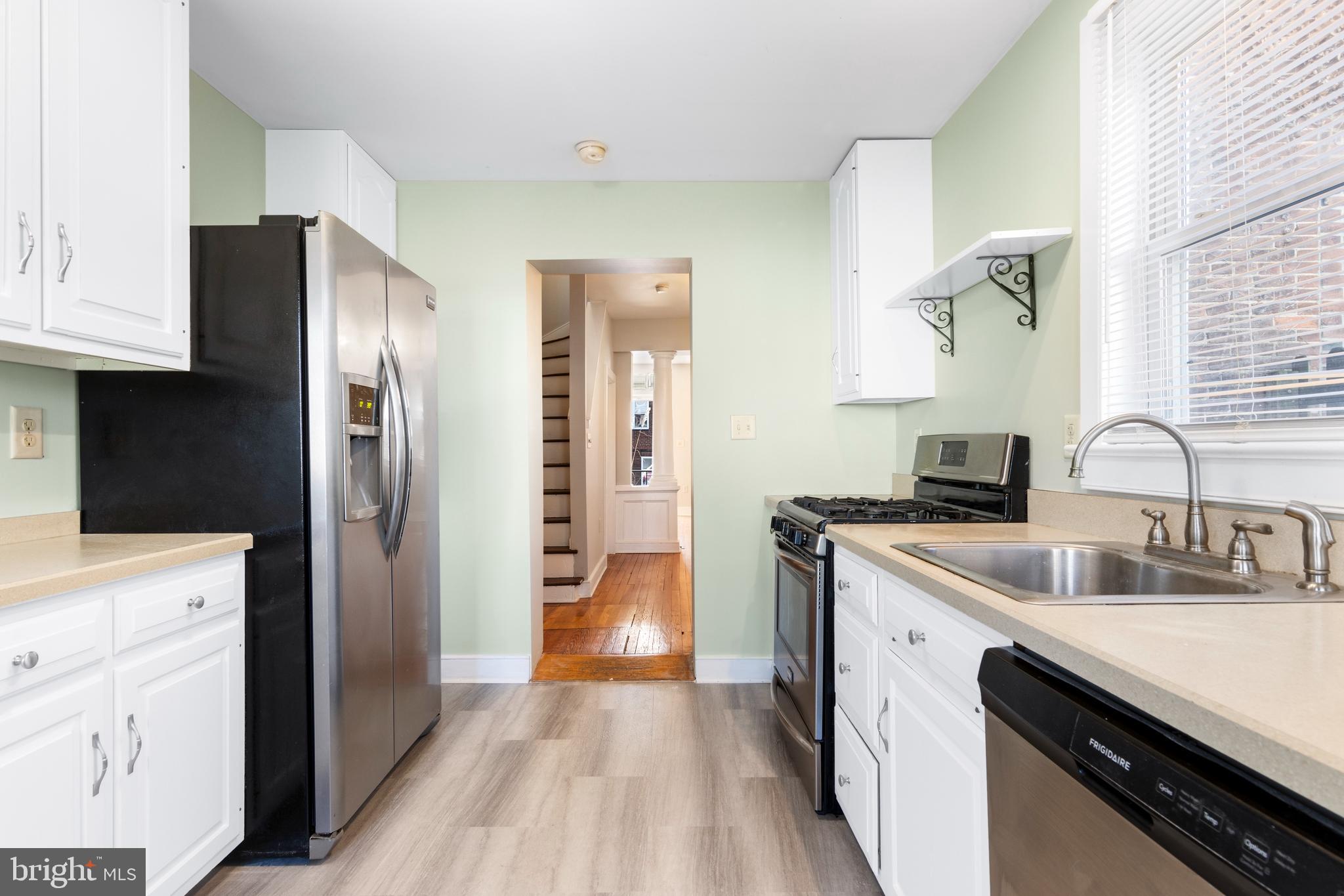 311 State Street Kennett Square, PA 19348 - Photo 21 of 37 a kitchen with stainless steel appliances granite countertop a refrigerator and a sink