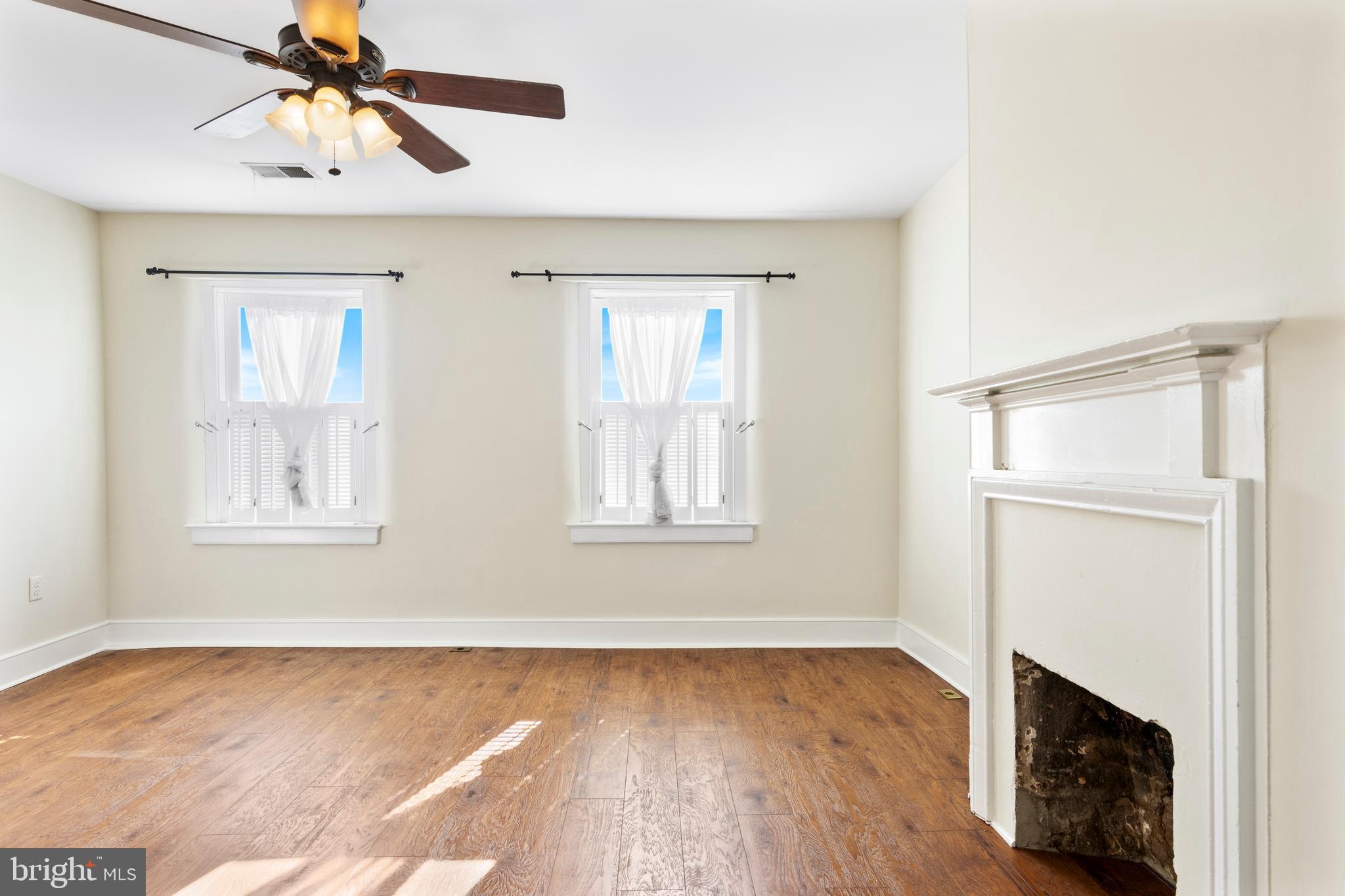 311 State Street Kennett Square, PA 19348 - Photo 26 of 37 a view of empty room with wooden floor and fan