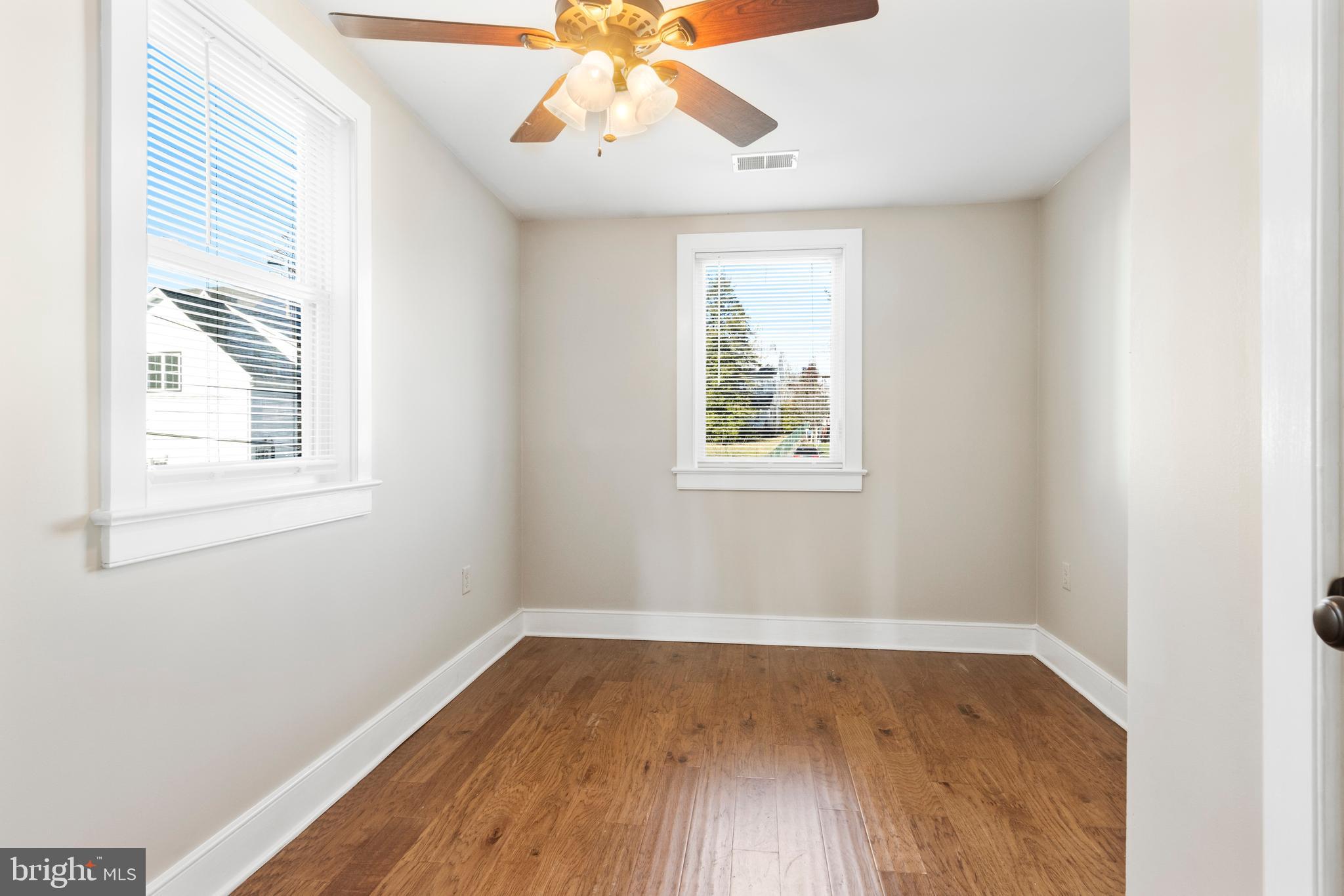 311 State Street Kennett Square, PA 19348 - Photo 28 of 37 an empty room with wooden floor and windows