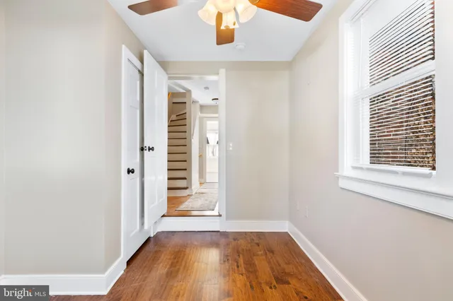 a view of an entryway door with wooden floor