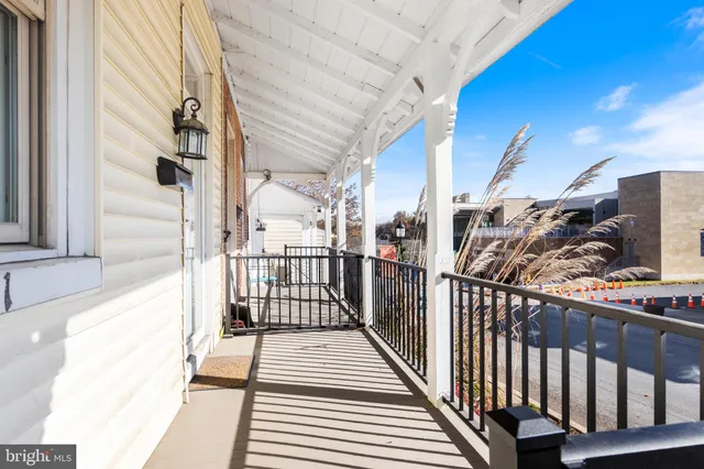 a view of a balcony with wooden floor