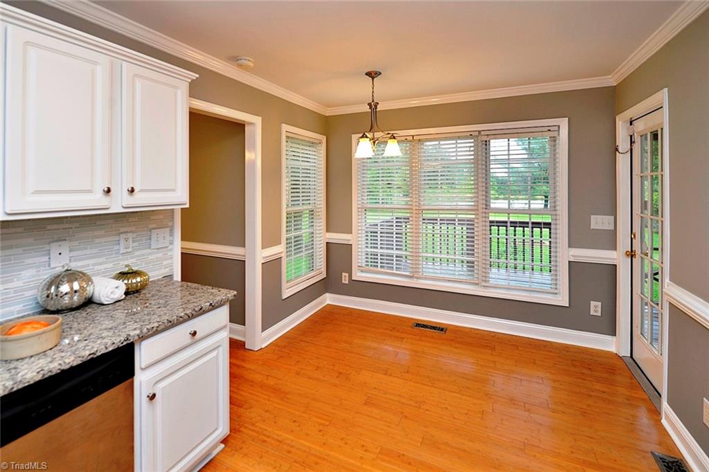 727 Reynolds Road Lewisville, NC 27023 - Photo 13 of 29 Kitchen has Breakfast Room that Overlooks View of Yard and Pond - Serene!