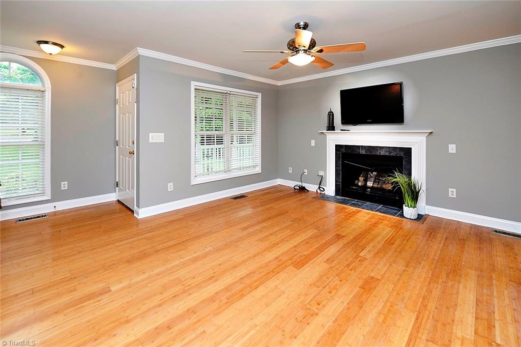 727 Reynolds Road Lewisville, NC 27023 - Photo 8 of 29 Gas Log Fireplace, Ceiling Fan, Flat Screened TV and Recent Floors - Just Move In!!