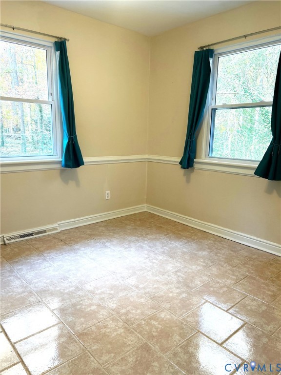 1042 Peck Road Richmond, VA 23235 - Photo 11 of 29 dinning area featuring baseboards and tile floorin