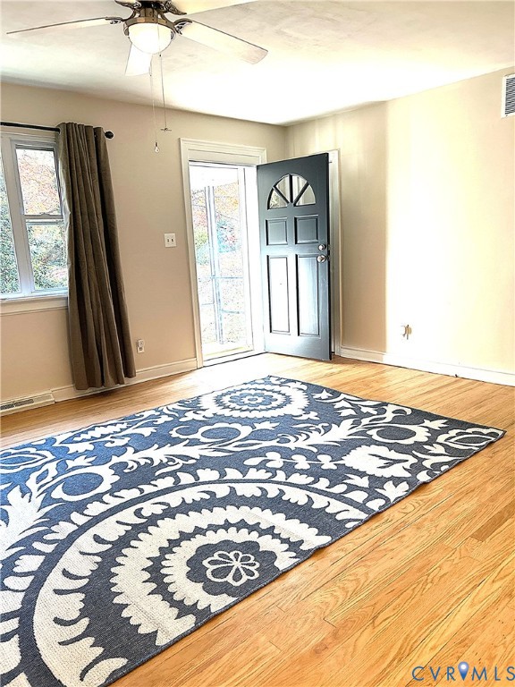 1042 Peck Road Richmond, VA 23235 - Photo 12 of 29 Living room light wood-style floors, plenty of nat