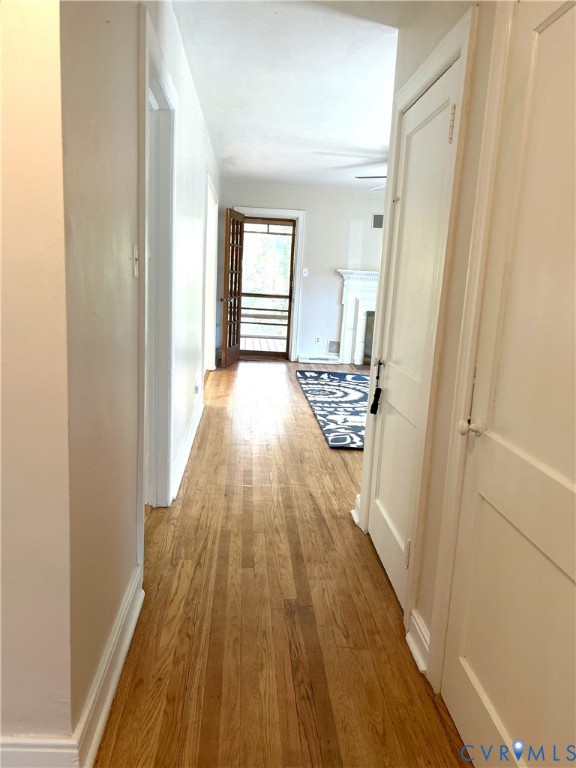 1042 Peck Road Richmond, VA 23235 - Photo 19 of 29 Hallway featuring light wood finished floors and b