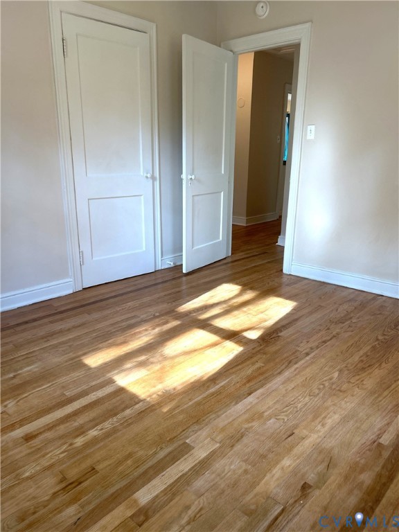1042 Peck Road Richmond, VA 23235 - Photo 22 of 29 bedroom featuring wood finished floors and a spac