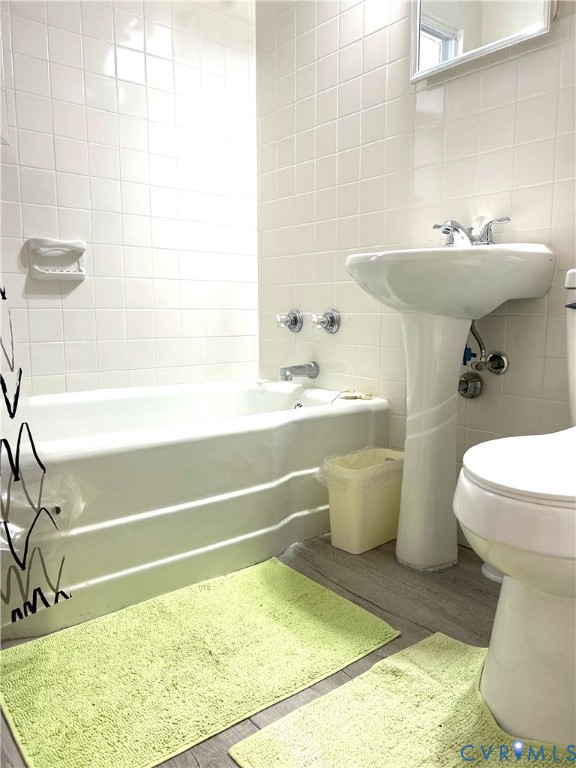 1042 Peck Road Richmond, VA 23235 - Photo 23 of 29 Full bathroom featuring tile walls, wood finished