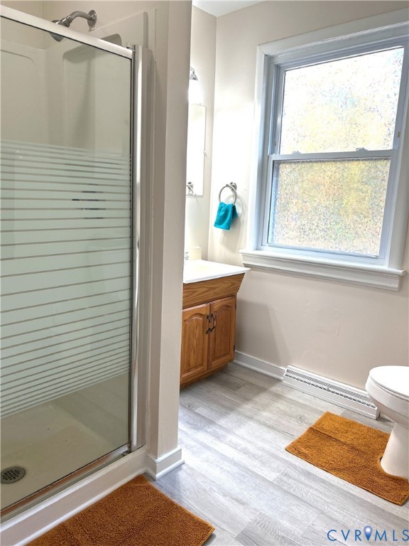 1042 Peck Road Richmond, VA 23235 - Photo 24 of 29 Bathroom with a stall shower, light wood-style flo