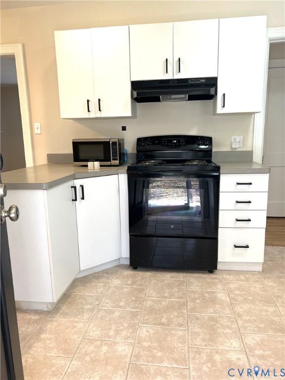 1042 Peck Road Richmond, VA 23235 - Photo 9 of 29 Kitchen with black electric range oven, white cabi