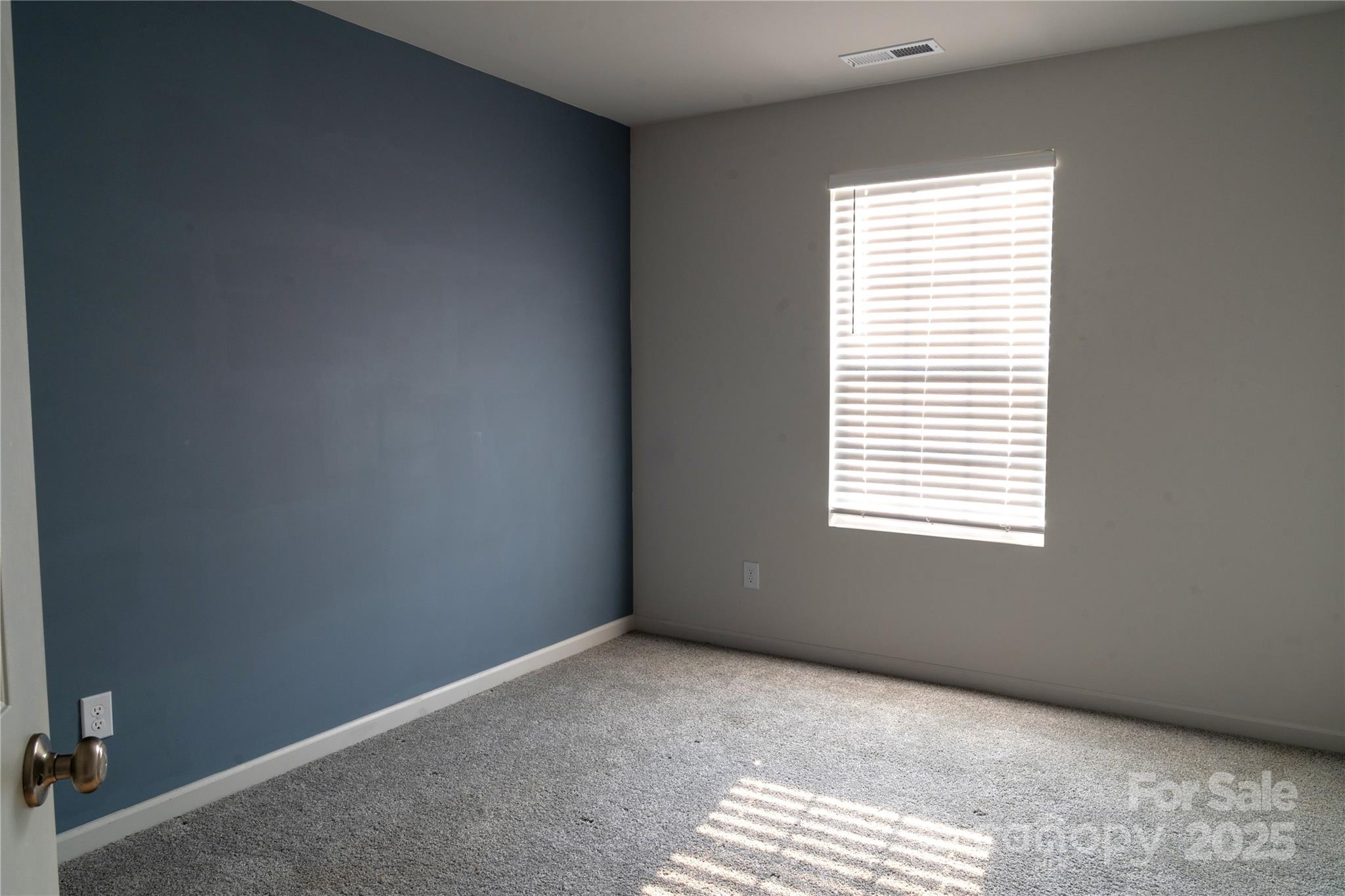 69 Ravibha Court Clayton, NC 27520 - Photo 12 of 16 a view of an empty room and a window