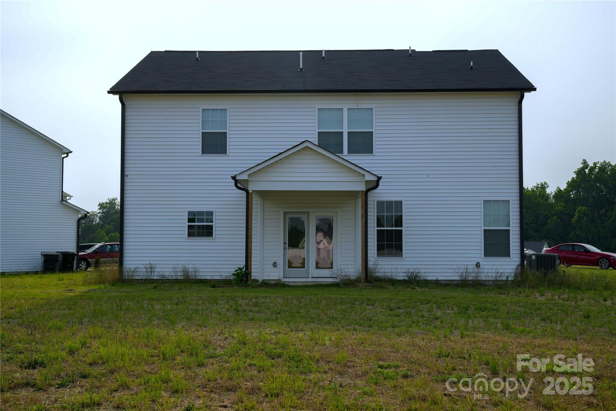 69 Ravibha Court Clayton, NC 27520 - Photo 15 of 16 a front view of a house with garden