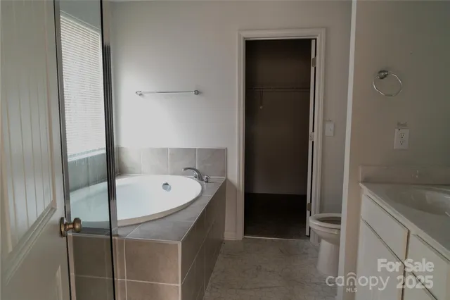 a bathroom with a bathtub and a sink
