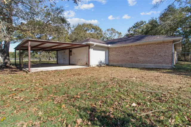 a big yard with wooden fence