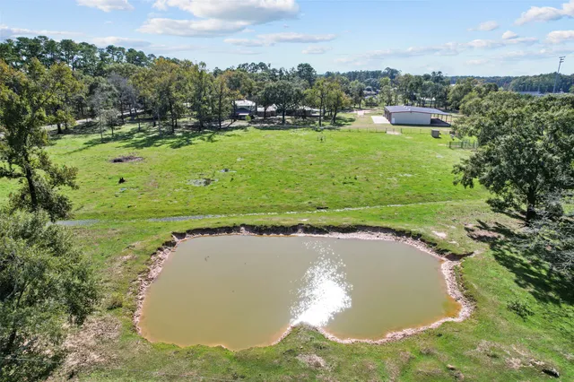 a view of a lake with a yard