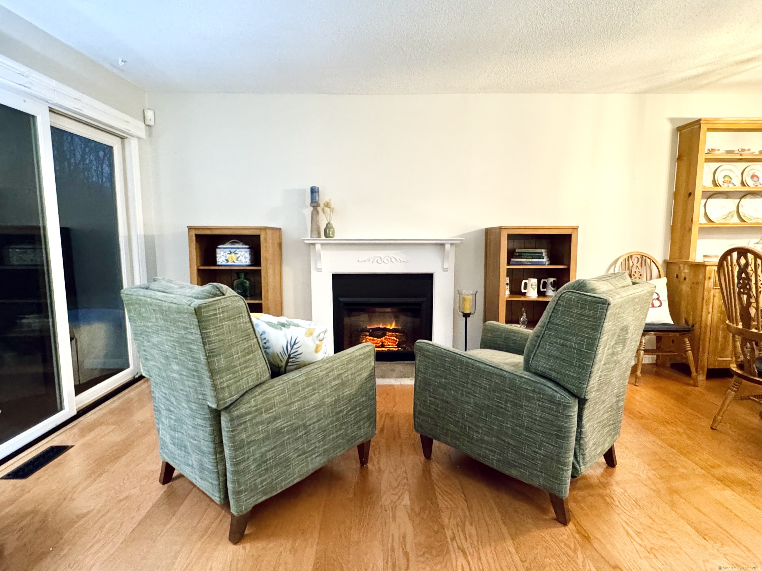 7 Honeysuckle Lane, Unit 7 Ridgefield, CT 06877 - Photo 12 of 22 Enjoy the Electric Fireplace