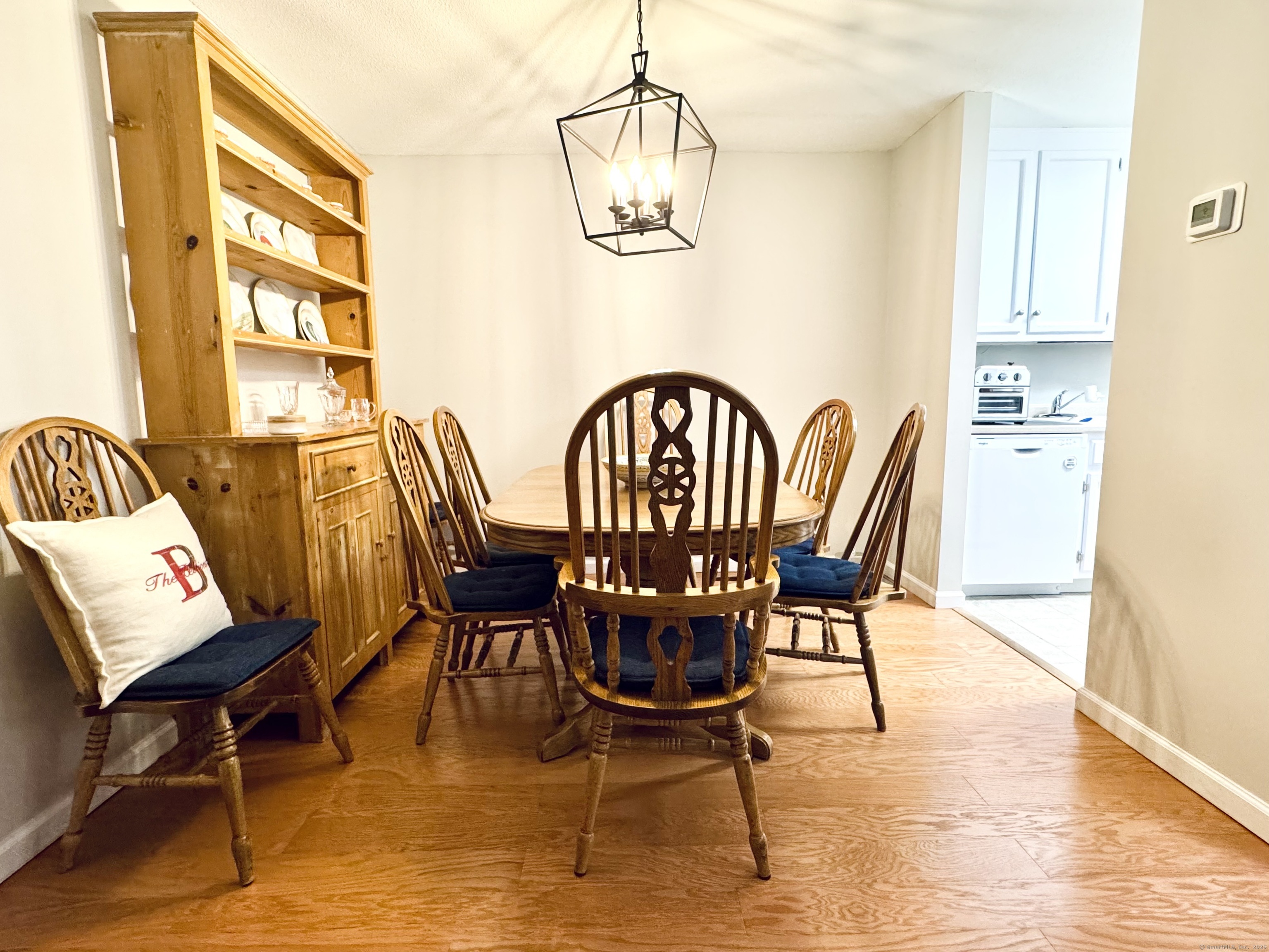 7 Honeysuckle Lane, Unit 7 Ridgefield, CT 06877 - Photo 9 of 22 Dining Room with Vinyl Plank Flooring