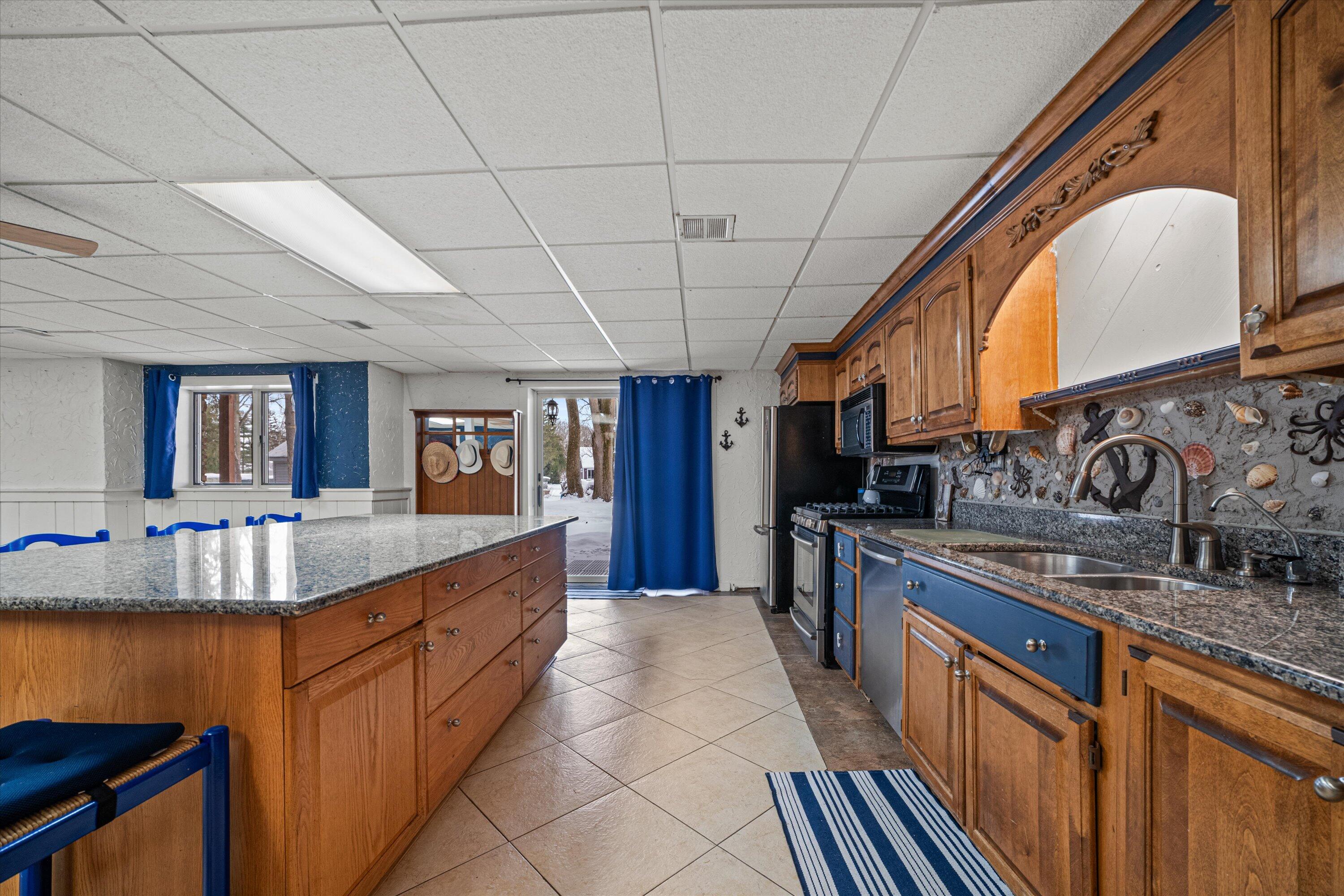 S108W34703 Jacks Bay Road Mukwonago, WI 53149 - Photo 39 of 74 Large Lower Level Full Kitchen