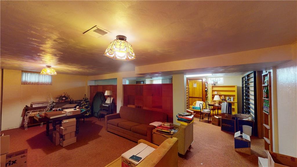 116 Germaine Road Butler, PA 16001 - Photo 28 of 43 a living room with furniture a dining table and chairs with wooden floor