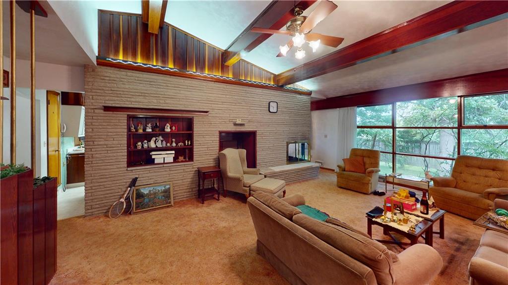 116 Germaine Road Butler, PA 16001 - Photo 6 of 43 a living room with furniture a fireplace and a large window