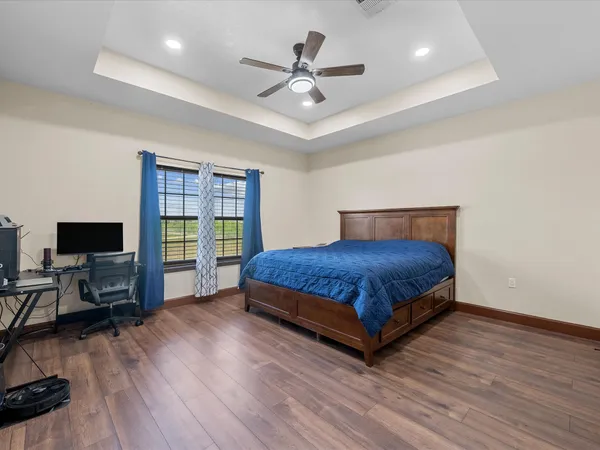 a bedroom with a bed and dresser