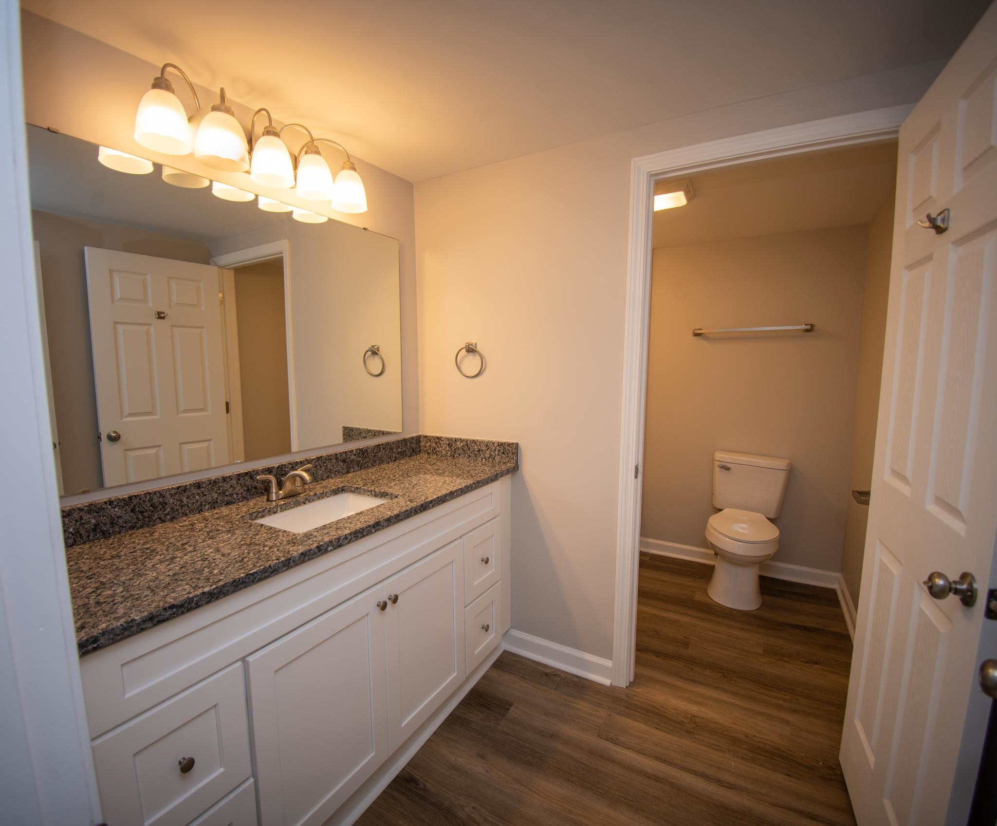 560 Covington Road Bunnlevel, NC 28323 - Photo 8 of 19 a bathroom with a granite countertop sink toilet and shower curtains