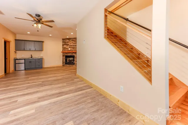 a view of an entryway with wooden floor and door