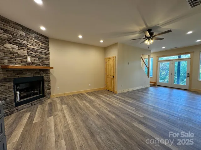a view of backyard with green space and seating area