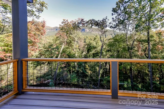 a view of balcony with wooden floor