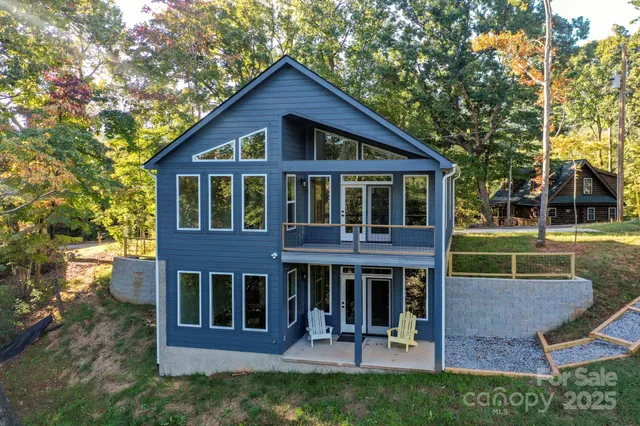 a view of a house with a patio and a garden
