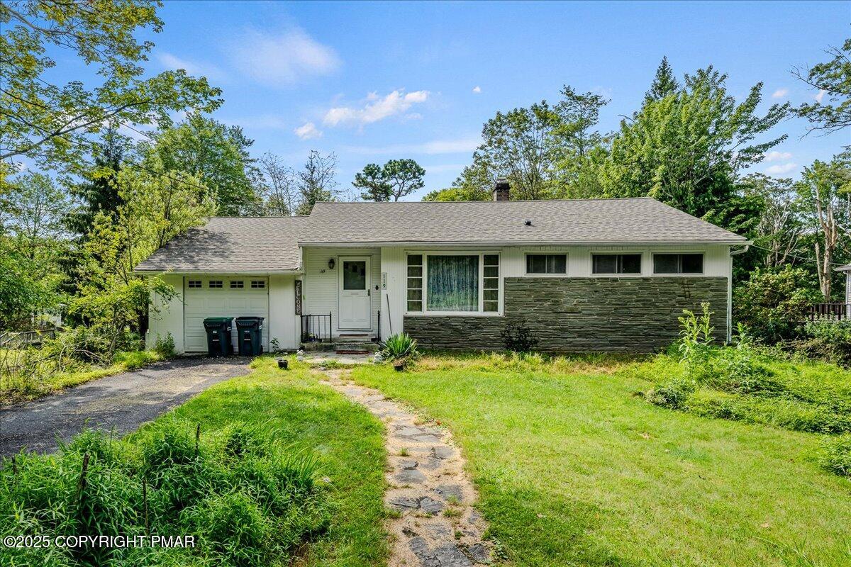 119 Knob Road Mount Pocono, PA 18344 - Photo 1 of 34 a front view of a house with yard and green space