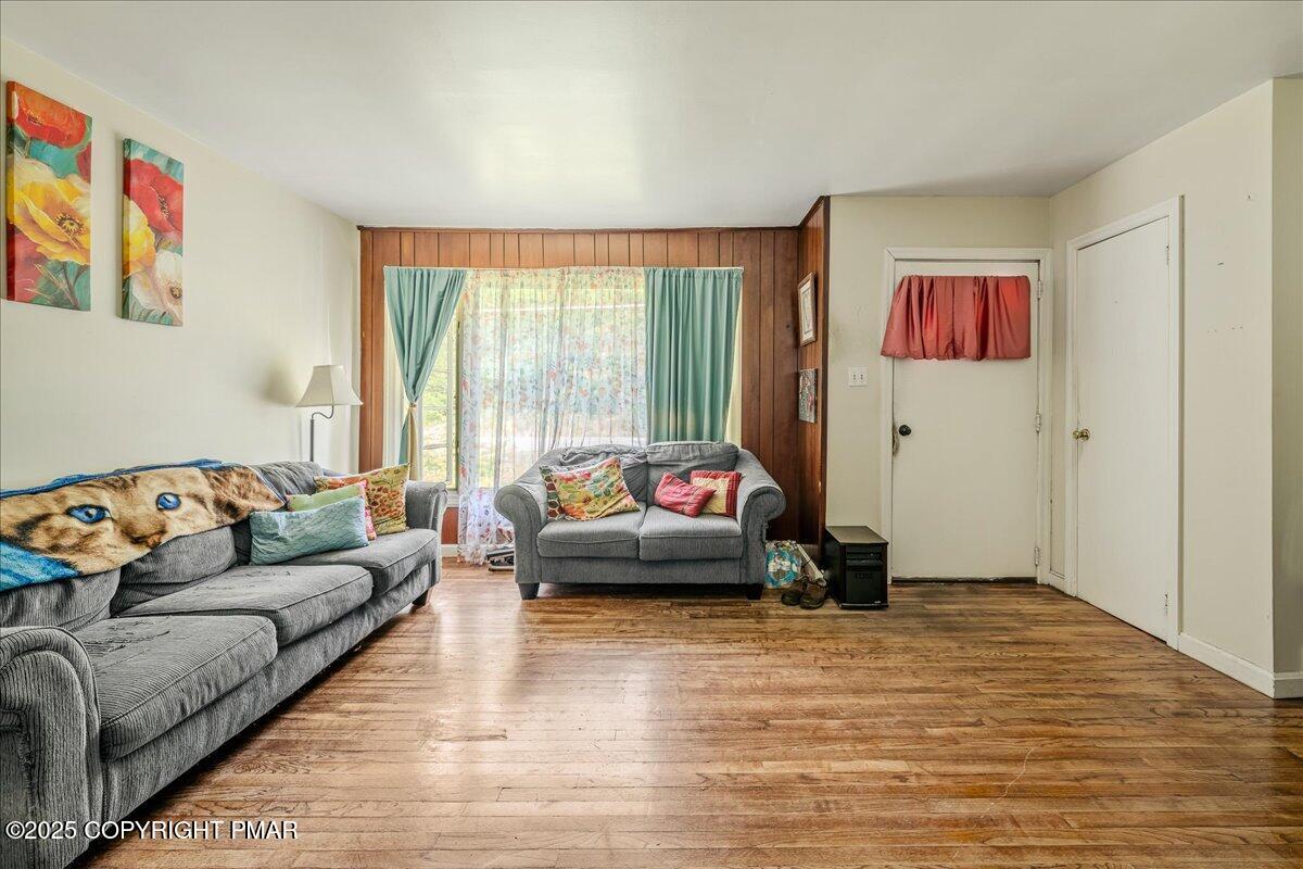 119 Knob Road Mount Pocono, PA 18344 - Photo 11 of 34 a living room with furniture and a large window