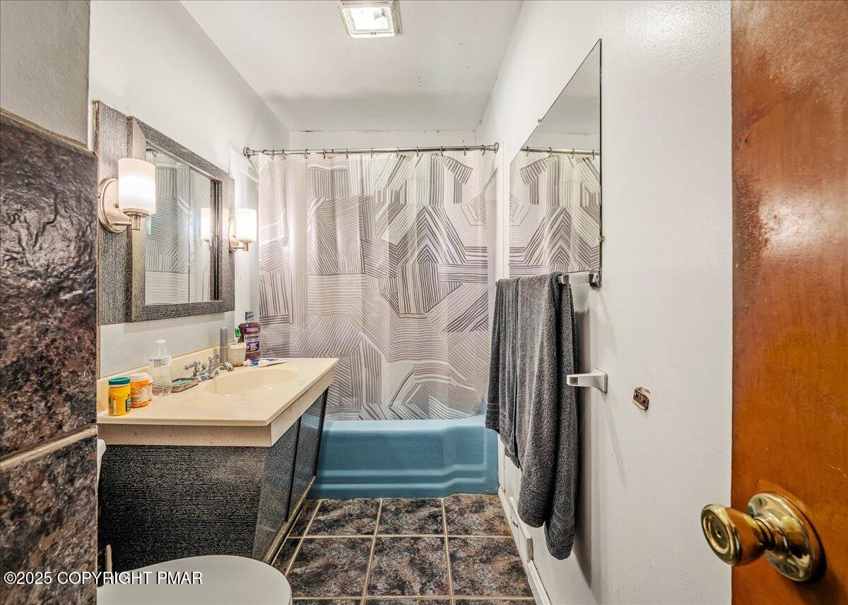 119 Knob Road Mount Pocono, PA 18344 - Photo 16 of 34 a bathroom with a sink toilet and shower