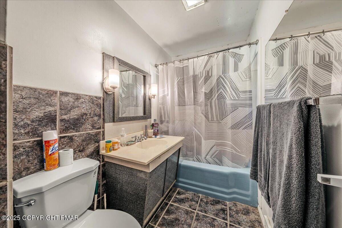 119 Knob Road Mount Pocono, PA 18344 - Photo 17 of 34 a bathroom with a sink toilet and shower