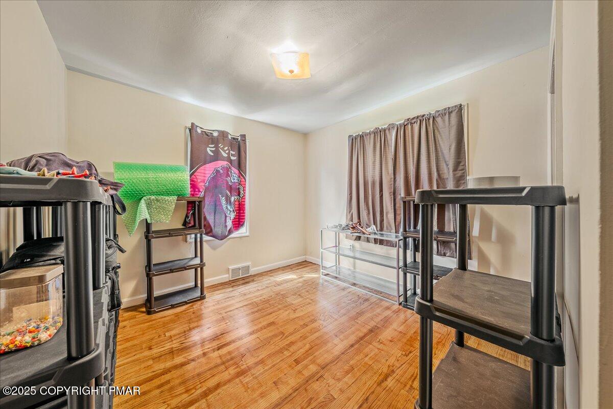 119 Knob Road Mount Pocono, PA 18344 - Photo 20 of 34 a view of a livingroom with furniture staircase and a fireplace