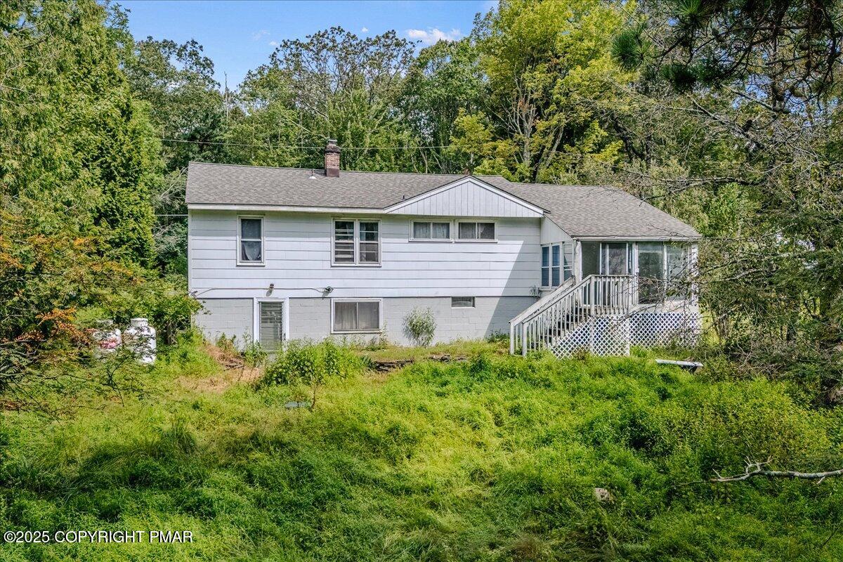 119 Knob Road Mount Pocono, PA 18344 - Photo 2 of 34 a house view with a garden space
