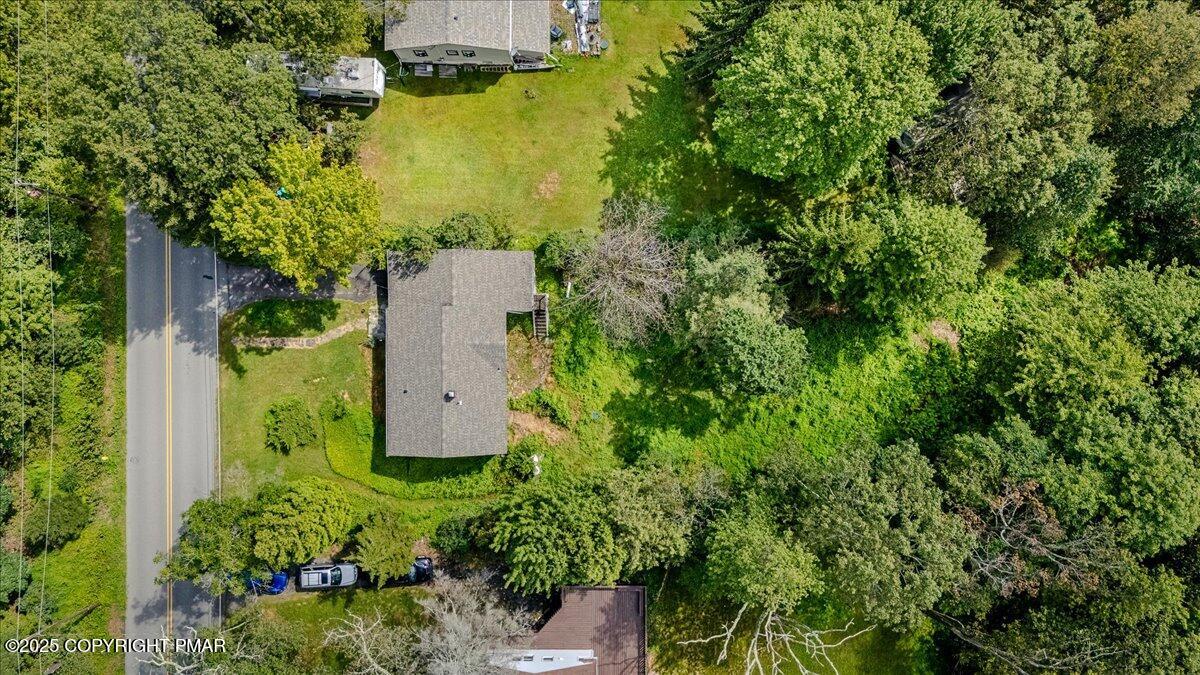 119 Knob Road Mount Pocono, PA 18344 - Photo 5 of 34 an aerial view of a house with a yard and lake view