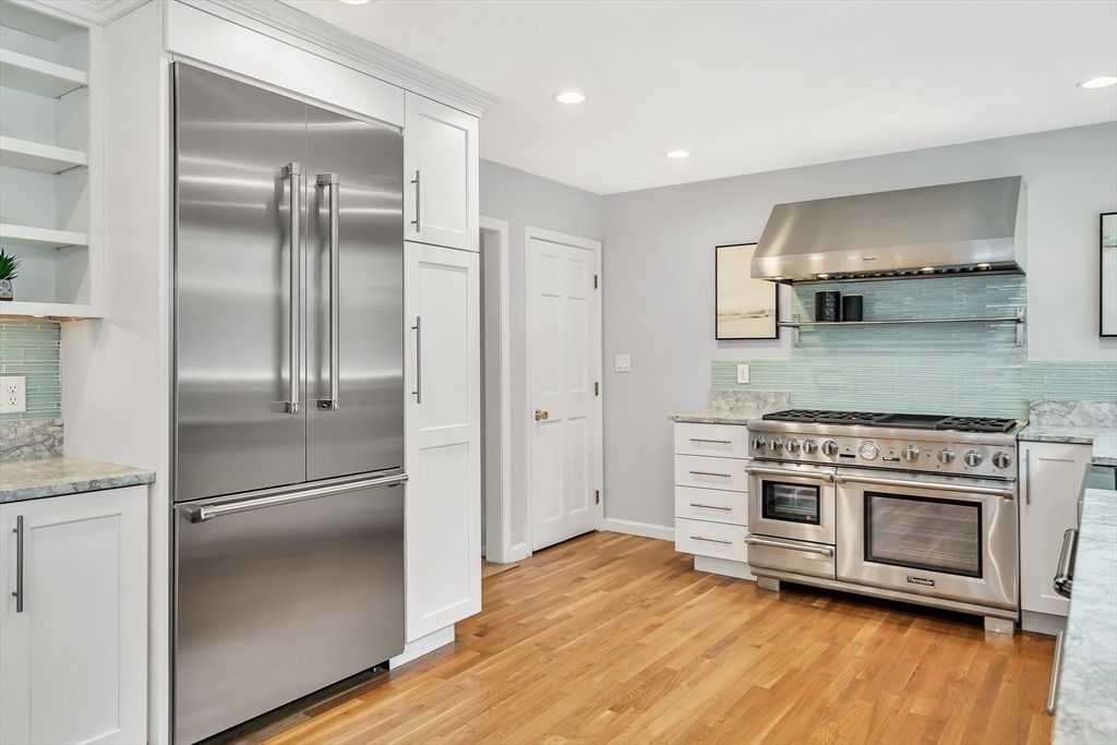 3 Bellantoni Drive Acton, MA 01720 - Photo 8 of 40 a kitchen with a refrigerator stove and wooden floor