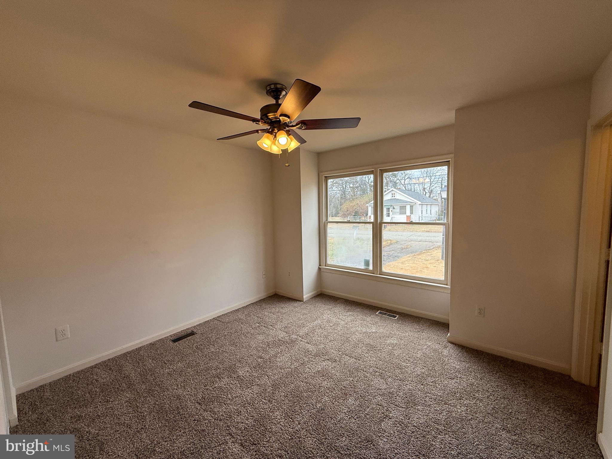 227 Bend Farm Road Fredericksburg, VA 22408 - Photo 19 of 22 an empty room with a window and a fan